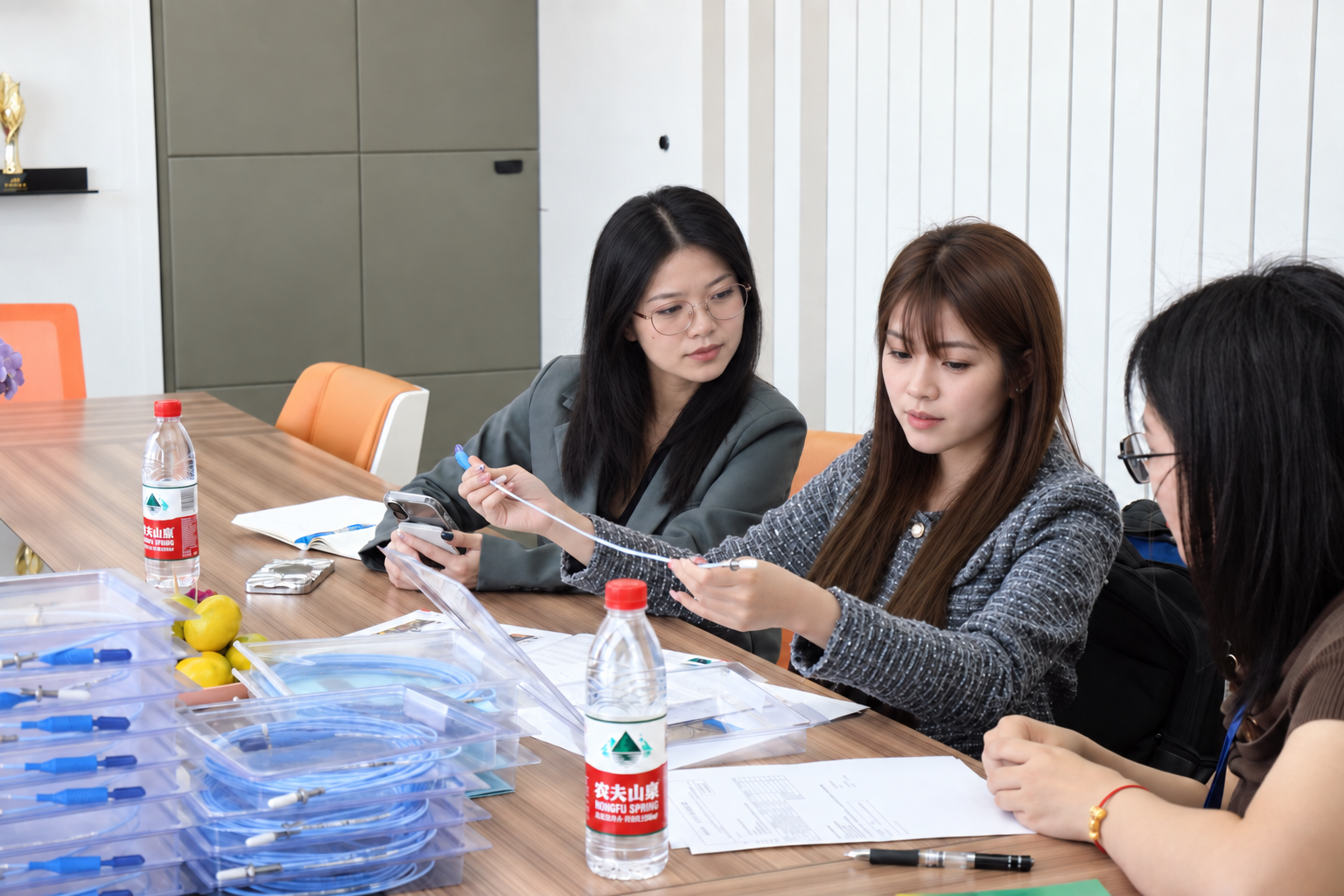 Thai customer holding a Bently Nevada cable while Leonia records inspection details
